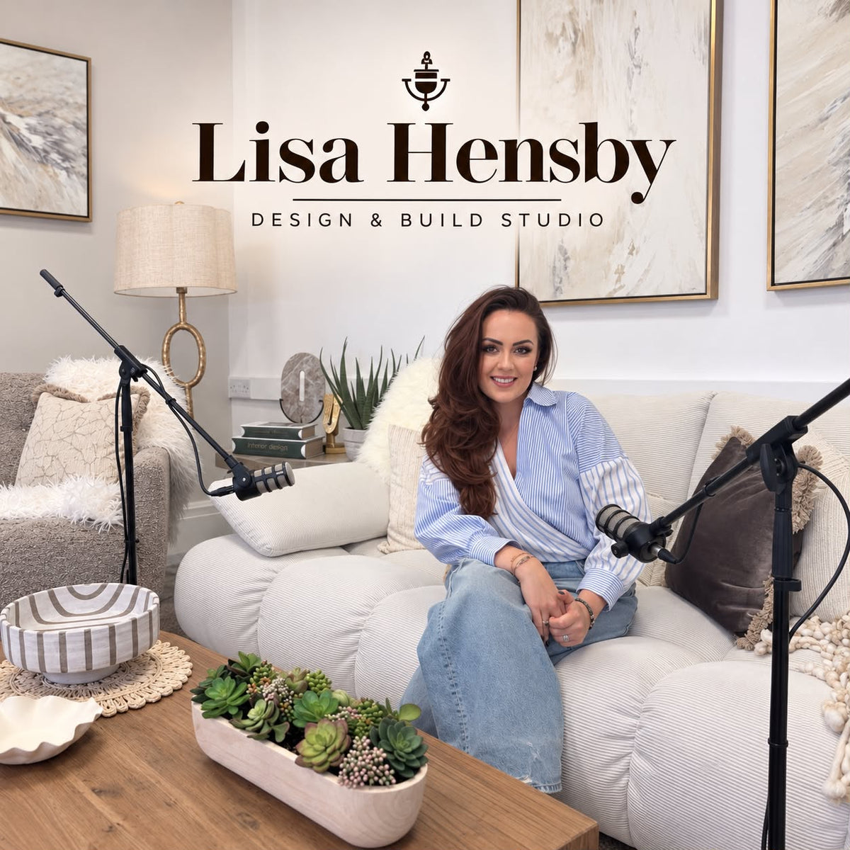 Lisa Hensby on the sofa in her studio, set up with microphones for recording the Heart & Home podcast